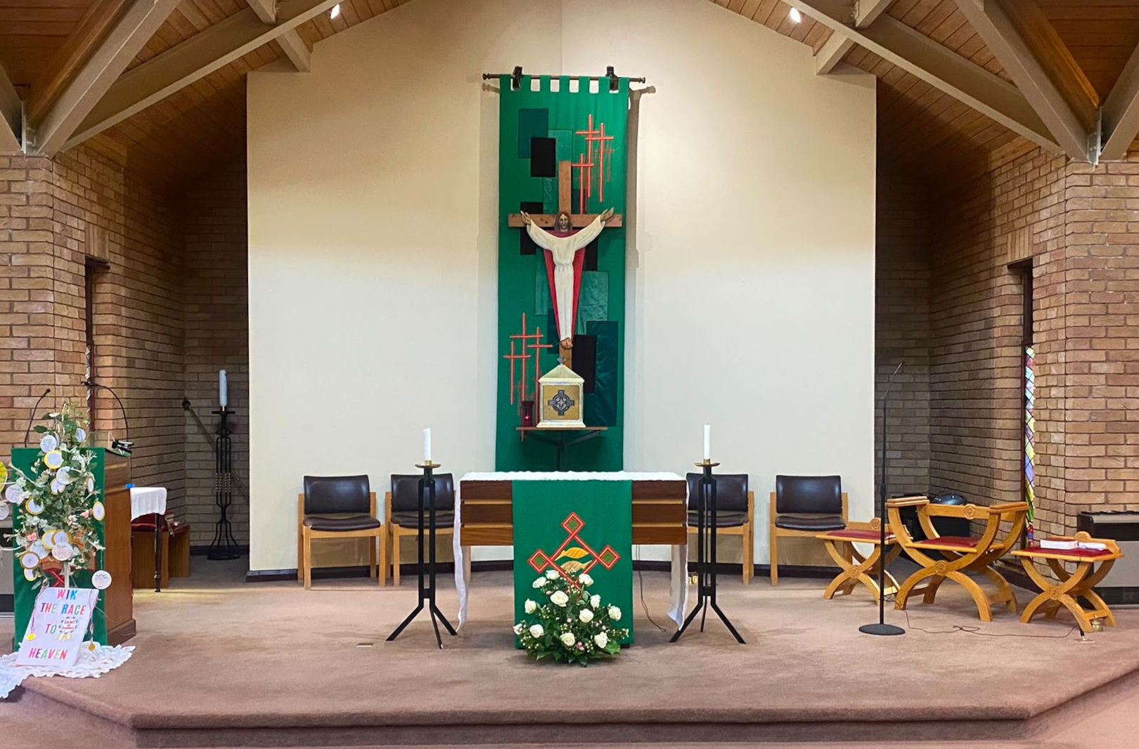 Interior of the church sanctuary with altar and stained glass